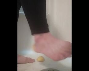 Steps on lemons in shower, grinds it in