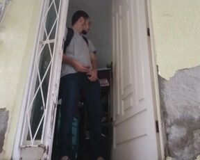 boy wearing jeans peeing out before going outside