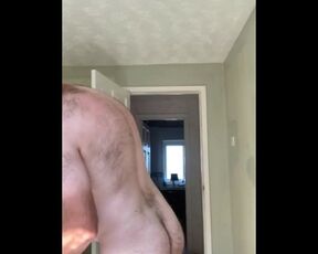 Hairy tubby exhibitionist guy working naked