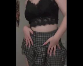 Pretty girl dancing in a sexy skirt.